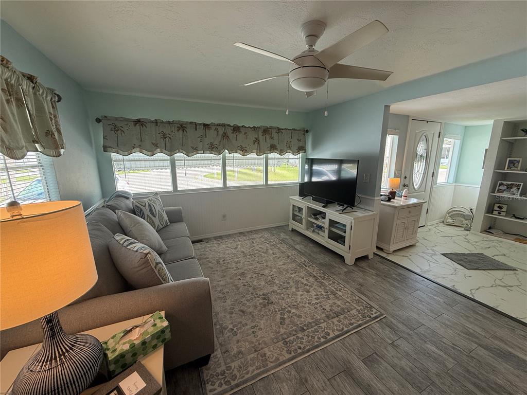 6190 Daffodil Road Venice, FL 34293 - Photo 7 of 22 a living room with furniture and a flat screen tv