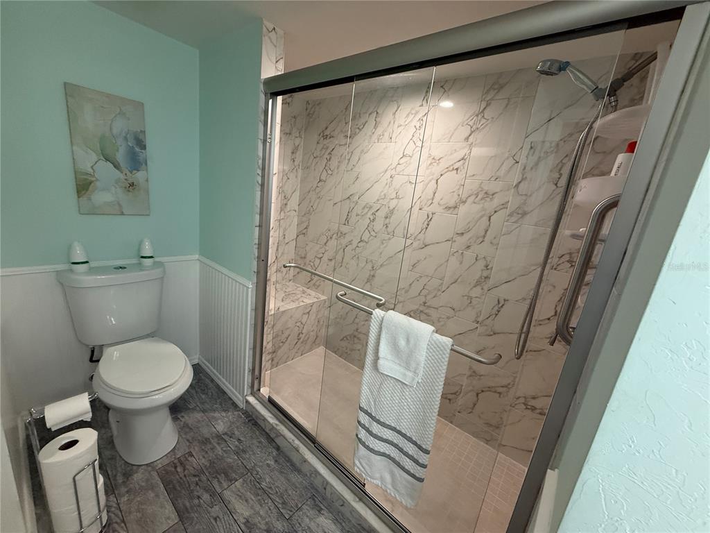 6190 Daffodil Road Venice, FL 34293 - Photo 9 of 22 a bathroom with a toilet and a shower