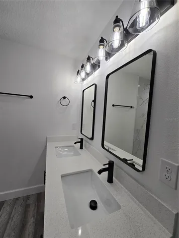 a bathroom with a sink and mirror