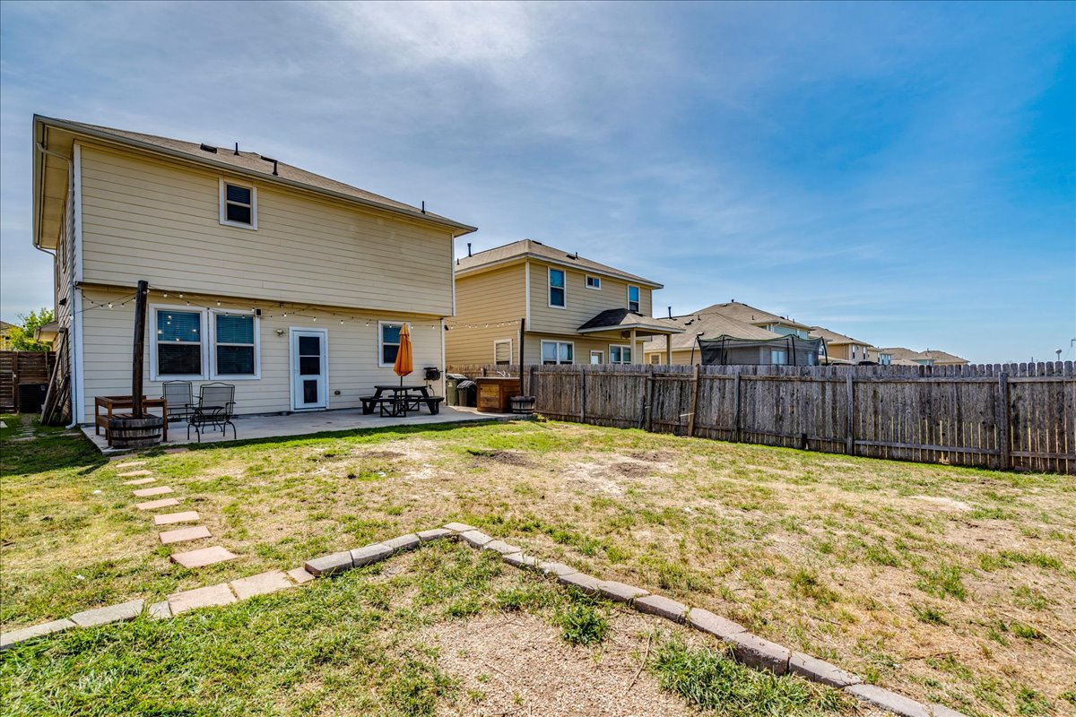 312 Triumph Road Buda, TX 78610 - Photo 33 of 36 a view of a house with swimming pool and sitting area