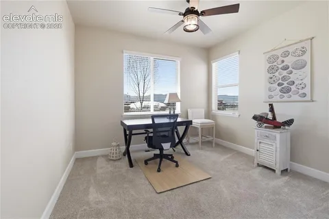 a view of a hallway with windows and closet