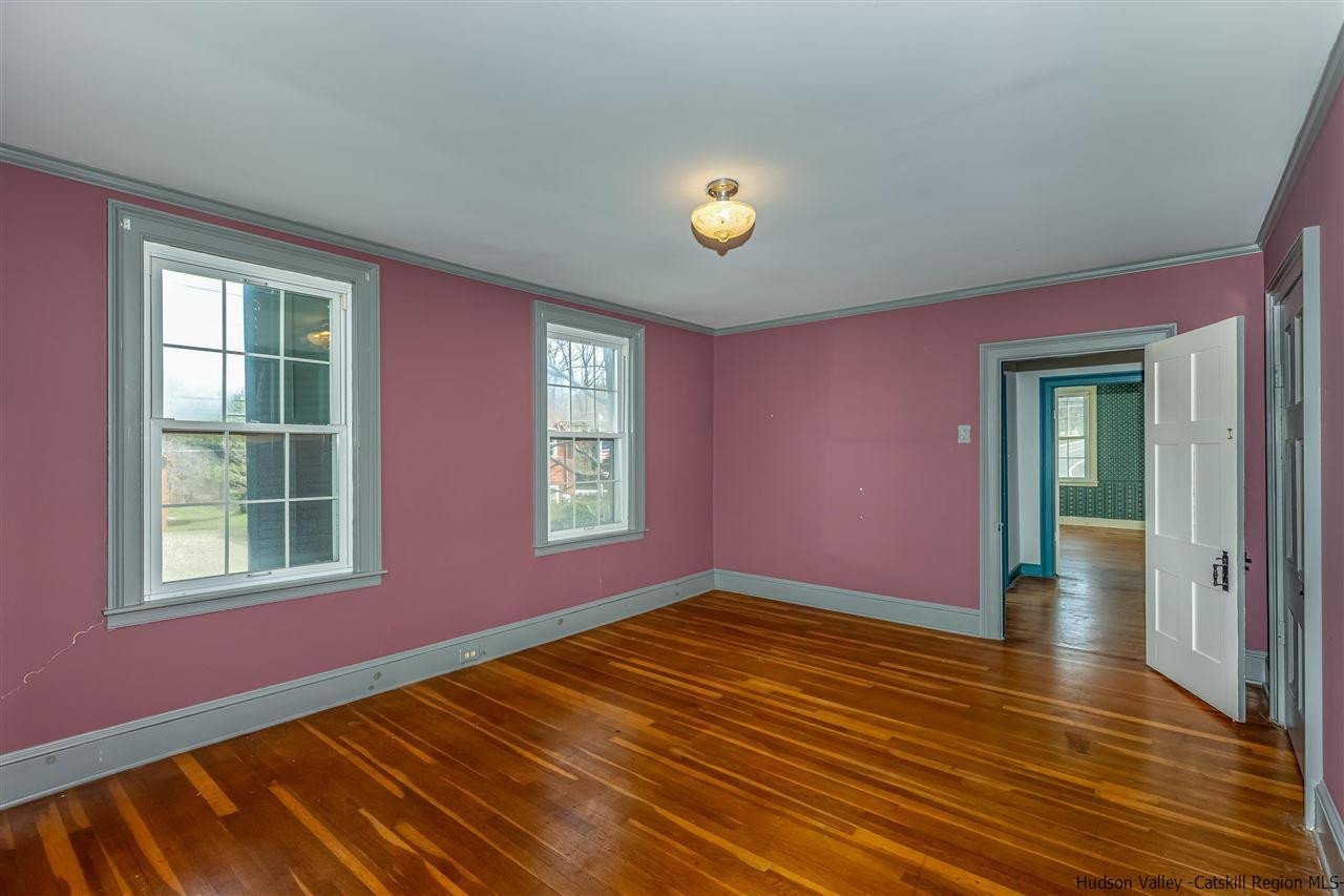 866 Hollow Road Salt Point, NY 12578 - Photo 23 of 32 a view of an empty room with window and wooden floor