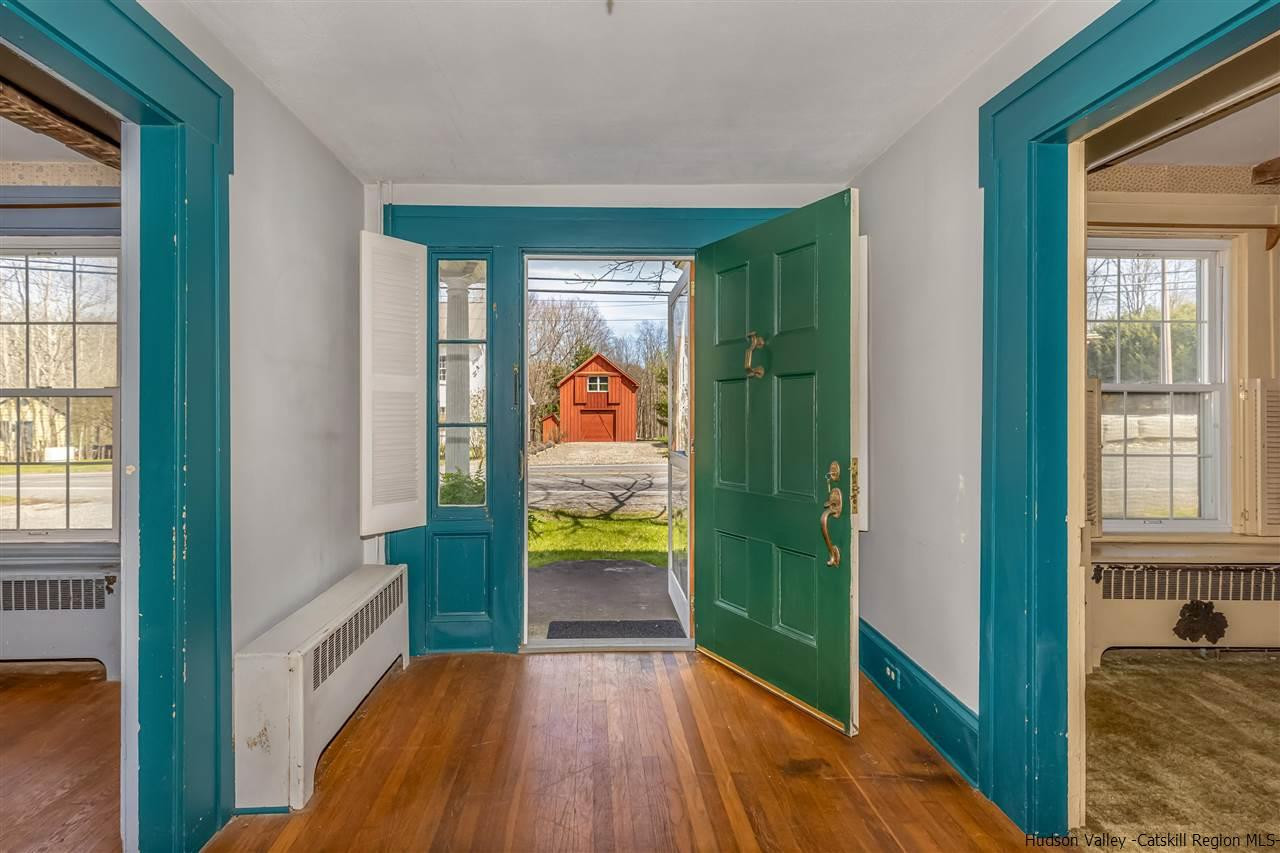 866 Hollow Road Salt Point, NY 12578 - Photo 8 of 32 a view of hallway with a large window and wooden floor