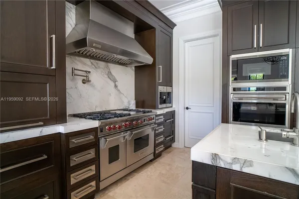 a kitchen with a stove and a microwave