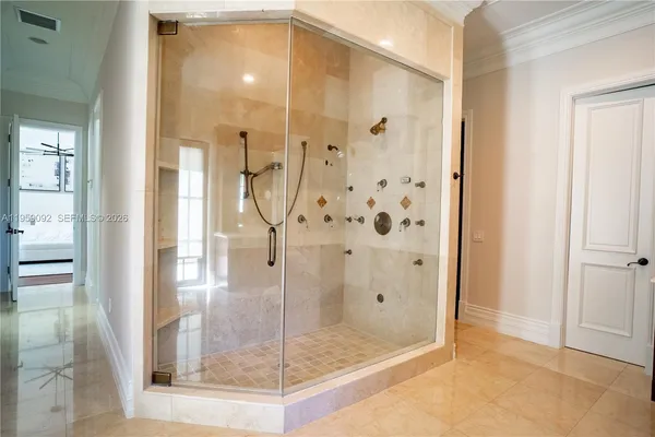 a bathroom with a glass shower door