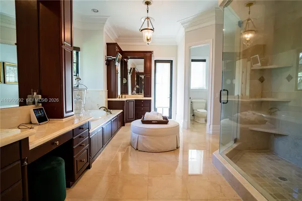 a large living room with a large window and furniture