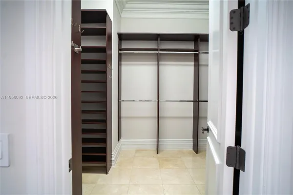 a view of closet with wooden floor