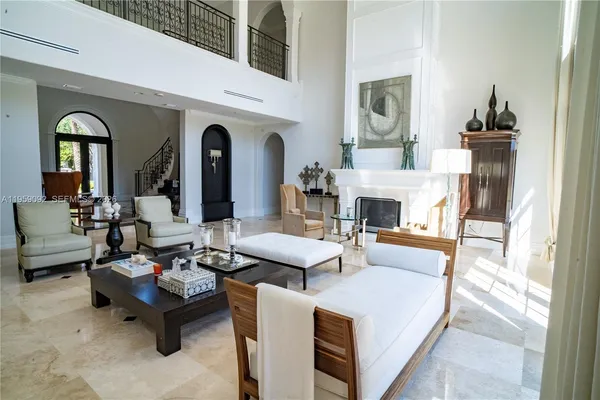 a living room with fireplace furniture and a wooden floor