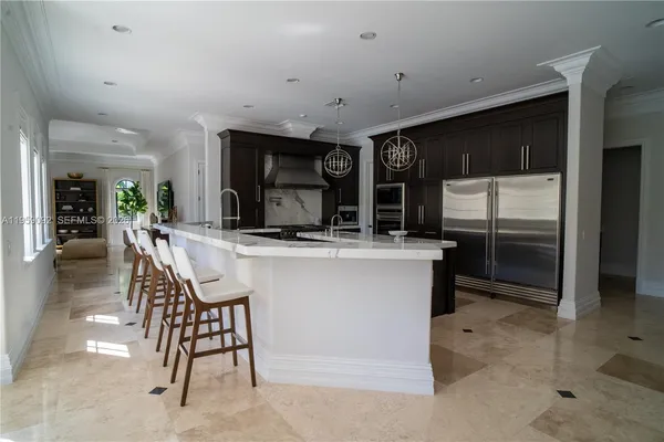 a kitchen with a table and chairs in it