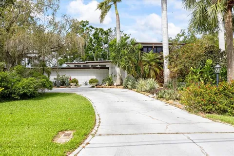 a view of a potted plants in front of a house