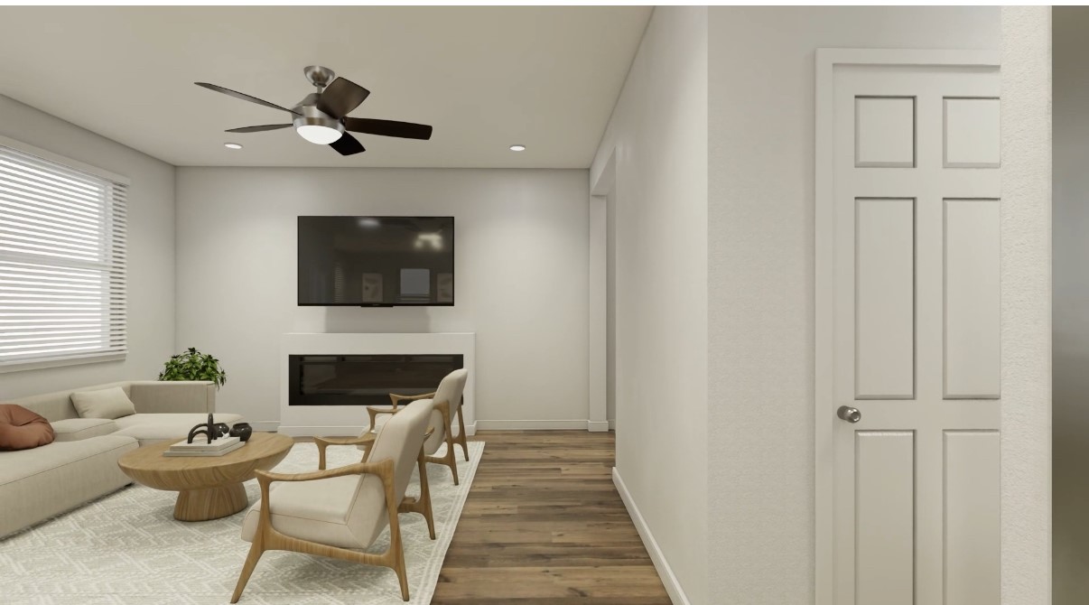 12110 Corsicana Trail, Unit 19B Manor, TX 78653 - Photo 16 of 23 Living area with wood finished floors, a glass covered fireplace, recessed lighting, and ceiling fan