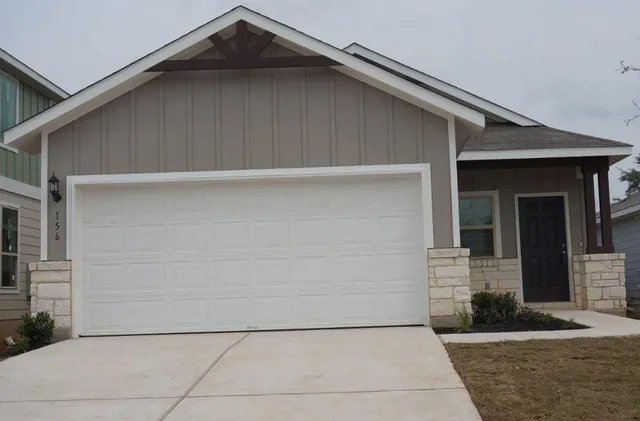a front view of a house with garage