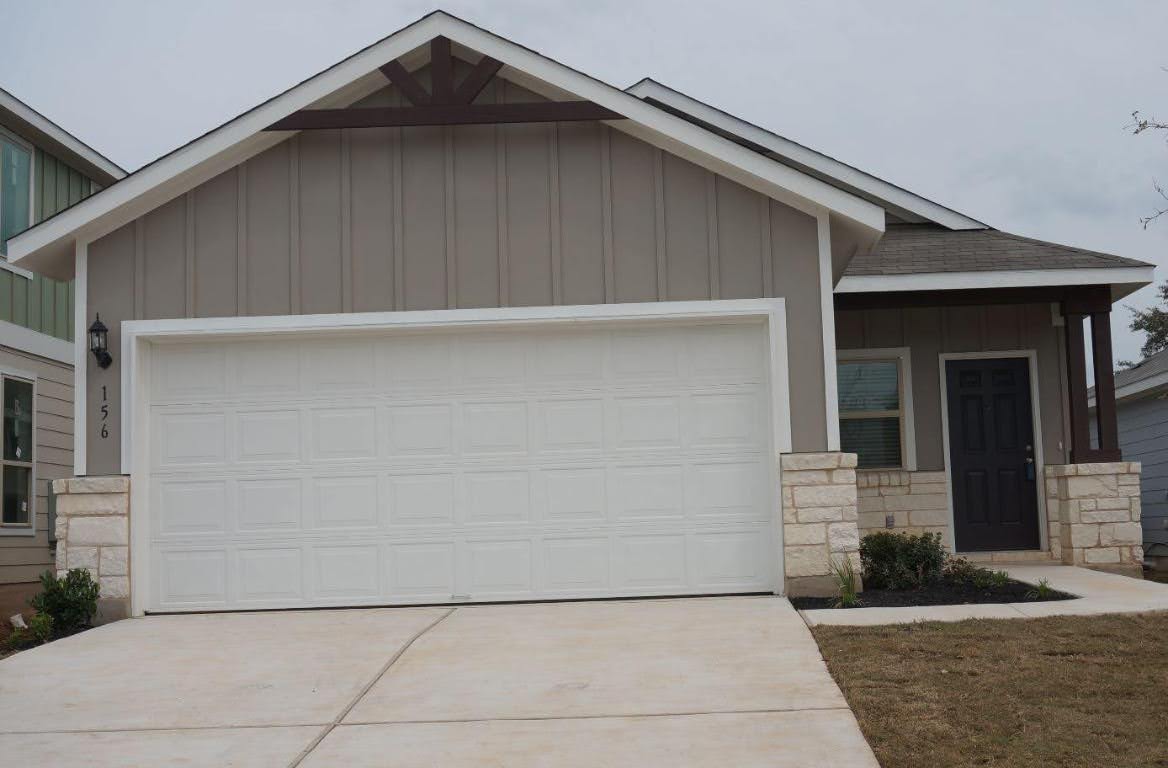 a front view of a house with garage