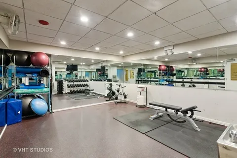 a room with lots of furniture and white walls