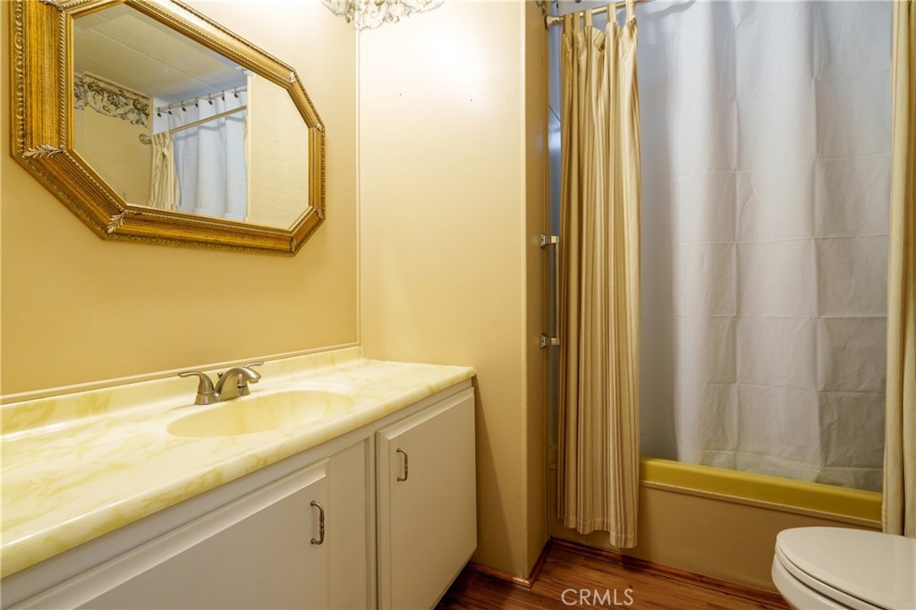 4000 Pierce Street, Unit 72 Riverside, CA 92505 - Photo 13 of 20 a bathroom with a sink and a mirror