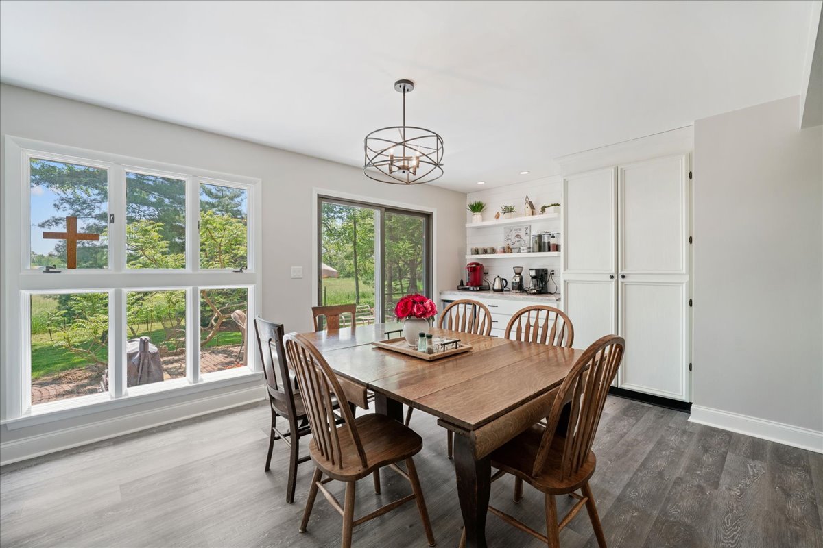 2N989 Beith Road Elburn, IL 60119 - Photo 13 of 35 a dining room with furniture a chandelier and wooden floor