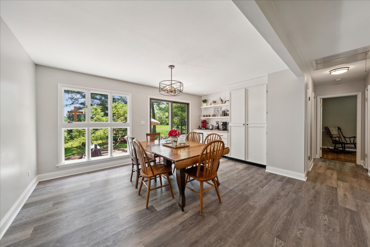 2N989 Beith Road Elburn, IL 60119 - Photo 14 of 35 a view of a dining room with furniture window and wooden floor