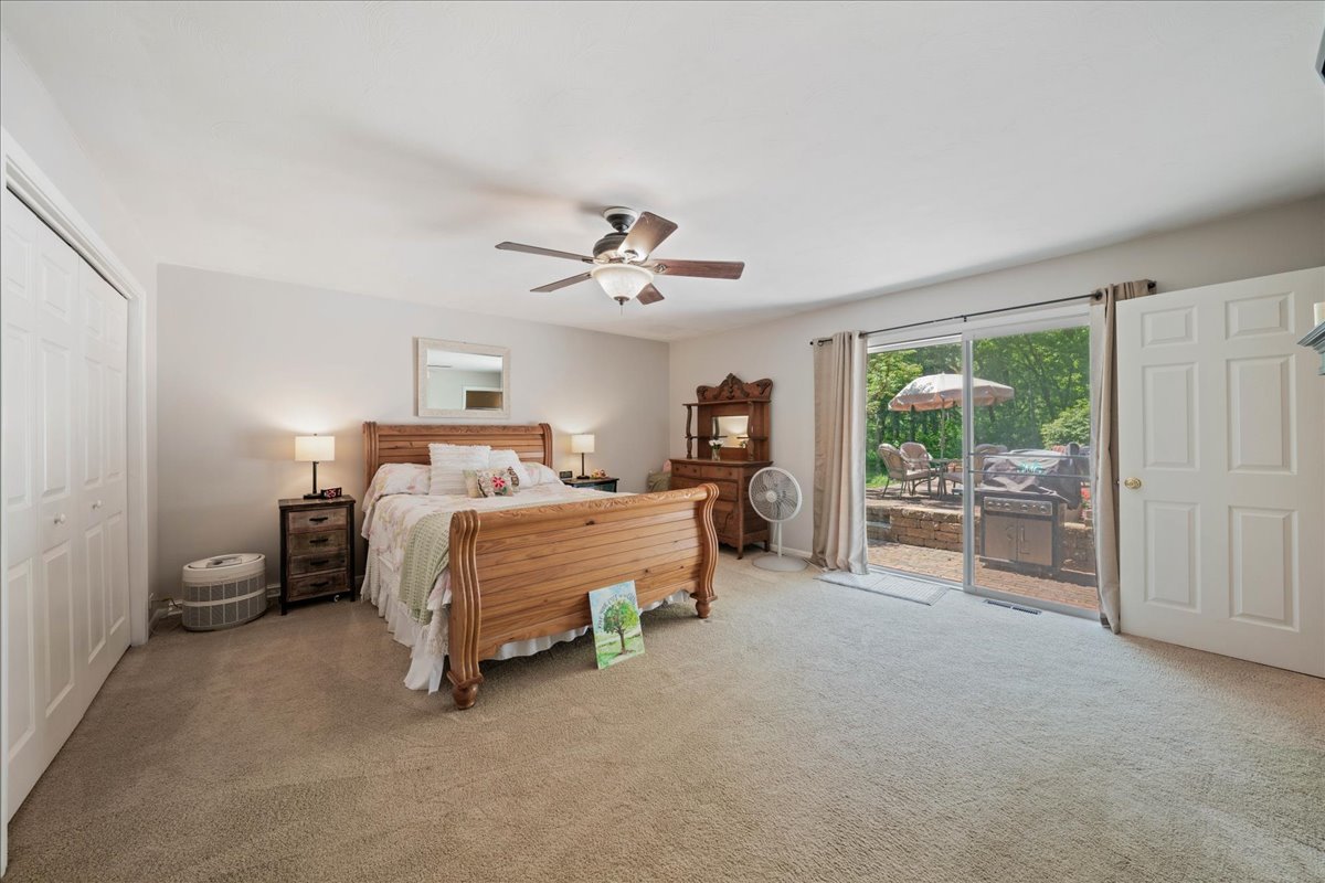 2N989 Beith Road Elburn, IL 60119 - Photo 16 of 35 a bed room with a bed and a chandelier