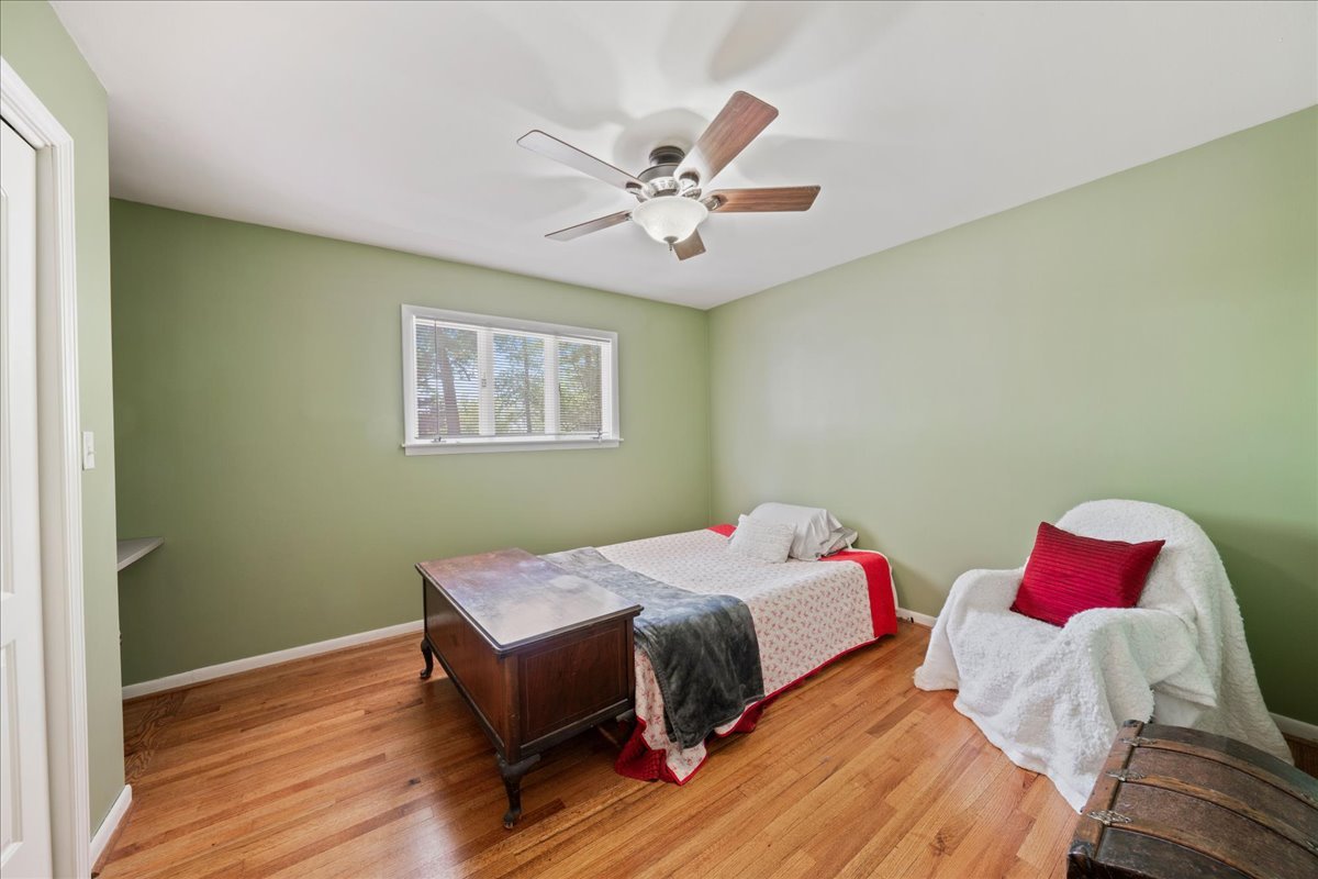 2N989 Beith Road Elburn, IL 60119 - Photo 21 of 35 a bedroom with a bed and a chandelier