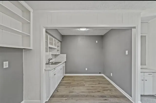a view of a kitchen from the hallway
