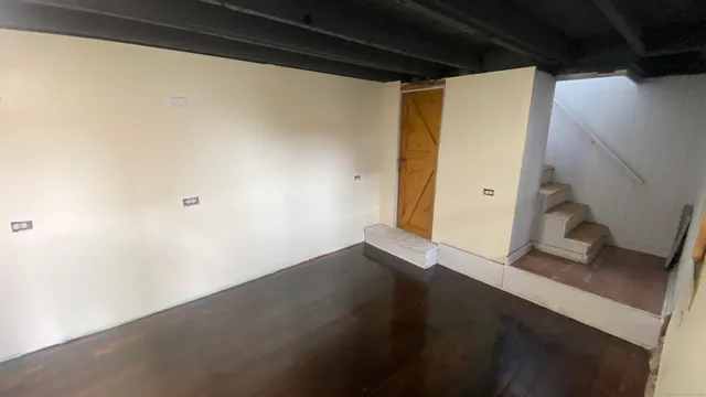 a view of small space with wooden floor