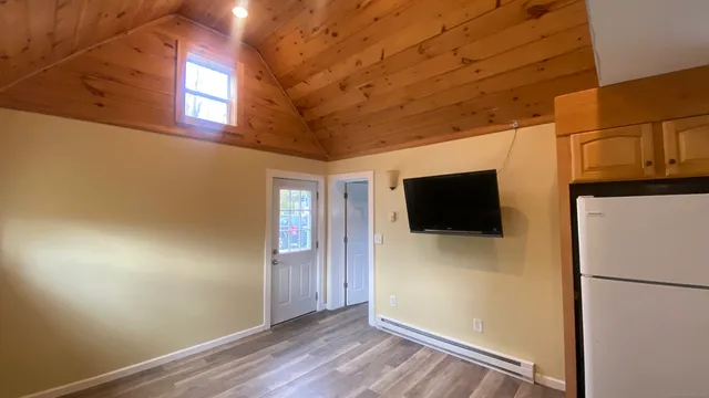 a view of a livingroom with wooden floor