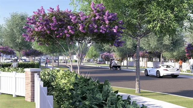 a street sign on a sidewalk next to a road