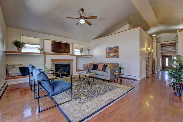a living room with furniture and a fireplace