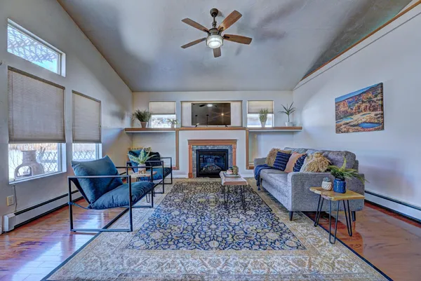 a living room with furniture and a fireplace