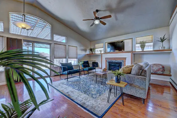 a living room with furniture and a fireplace
