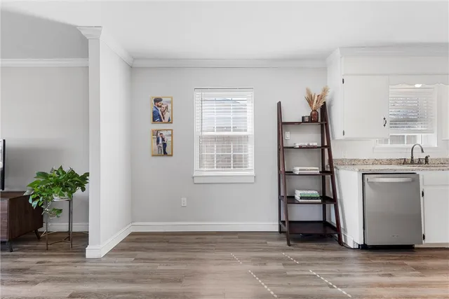 a view of kitchen with furniture wooden floor and window