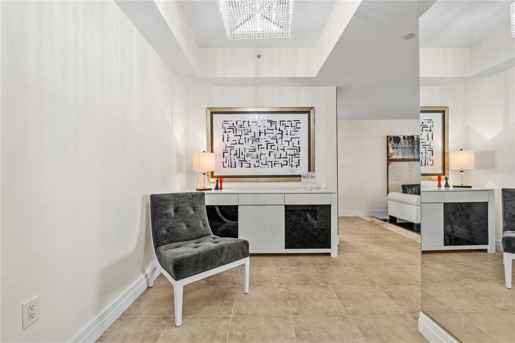 331 Cleveland Street, Unit 1103 Clearwater, FL 33755 - Photo 3 of 75 a living room with furniture a fireplace and a window