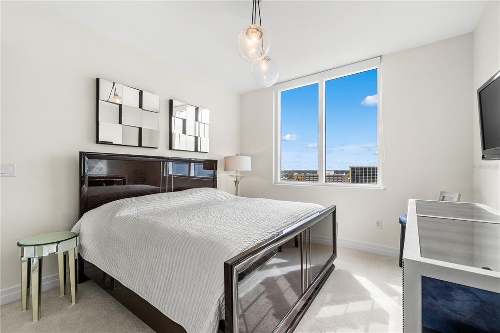 331 Cleveland Street, Unit 1103 Clearwater, FL 33755 - Photo 31 of 75 a bedroom with a bed and a window