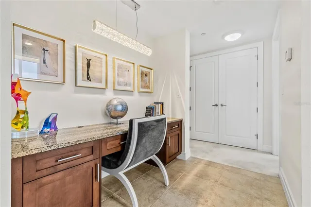 a view of a livingroom with furniture and a flat screen tv