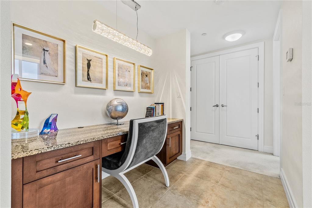 331 Cleveland Street, Unit 1103 Clearwater, FL 33755 - Photo 34 of 75 a view of cabinets a sink wooden floor and a window