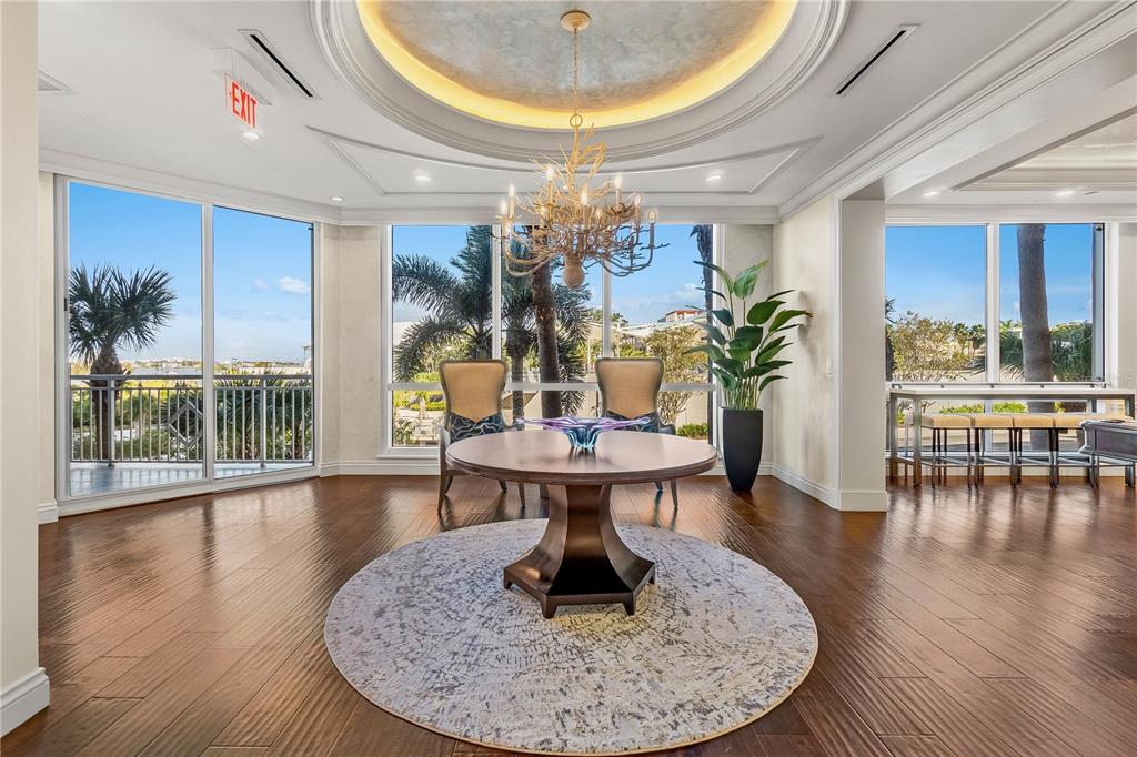 331 Cleveland Street, Unit 1103 Clearwater, FL 33755 - Photo 44 of 75 a living room with furniture and a chandelier