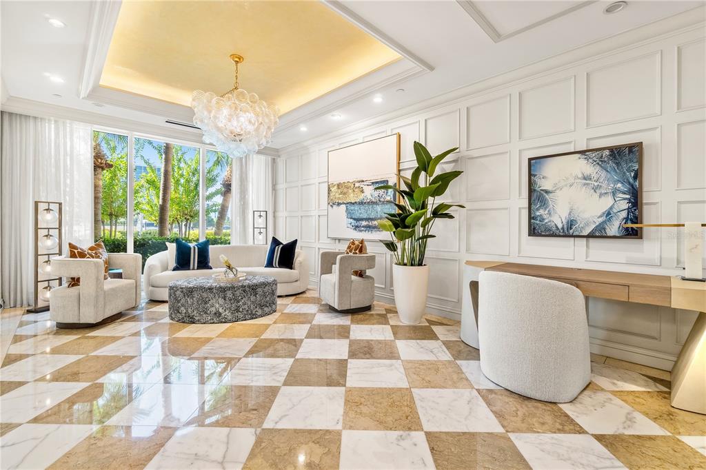 331 Cleveland Street, Unit 1103 Clearwater, FL 33755 - Photo 49 of 75 a living room with furniture and a potted plant