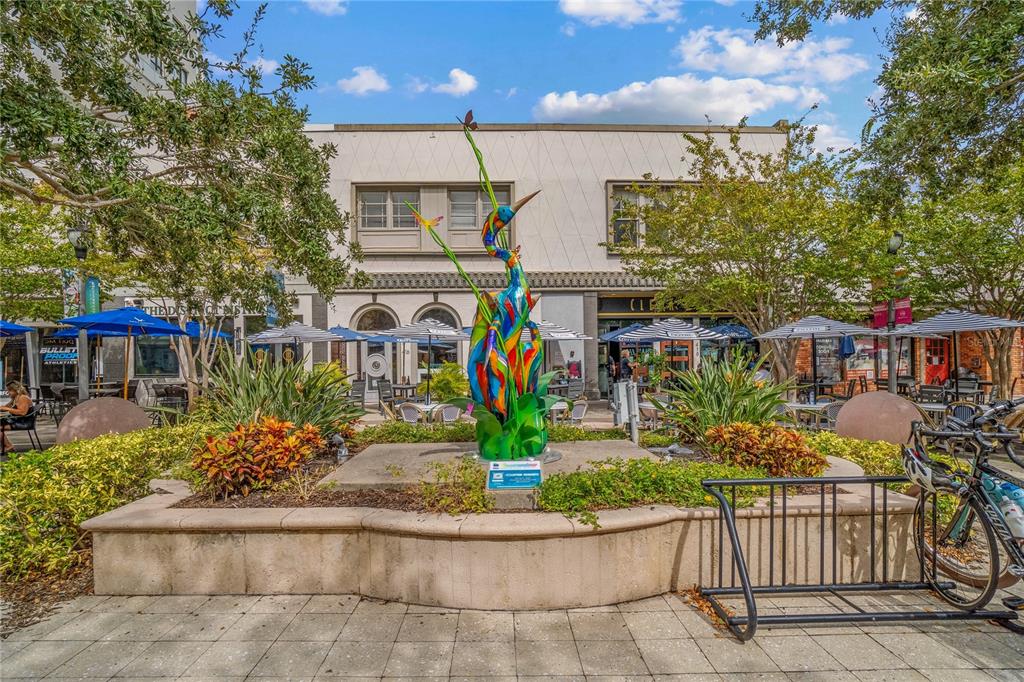 331 Cleveland Street, Unit 1103 Clearwater, FL 33755 - Photo 58 of 75 a view of a house with a yard and potted plants