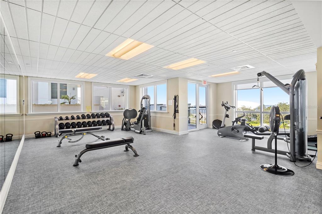 331 Cleveland Street, Unit 1103 Clearwater, FL 33755 - Photo 63 of 75 a living room with furniture gym equipment and a ceiling fan