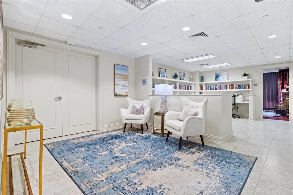 331 Cleveland Street, Unit 1103 Clearwater, FL 33755 - Photo 66 of 75 a living room with furniture and a rug