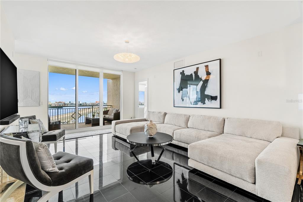 331 Cleveland Street, Unit 1103 Clearwater, FL 33755 - Photo 7 of 75 a living room with furniture and a large window