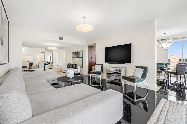 a large kitchen with stainless steel appliances granite countertop a refrigerator and a sink