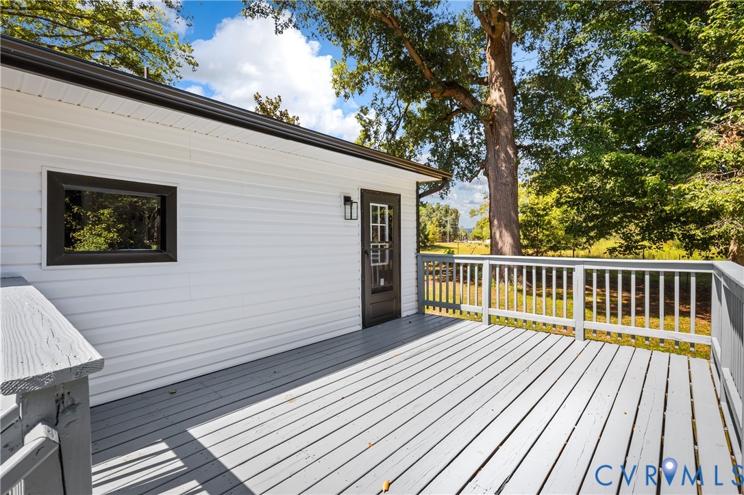 8409 Hopkins Road North Chesterfield, VA 23237 - Photo 46 of 51 Expansive outdoor deck with a painted wooden surfa