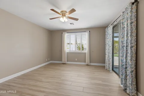 a view of livingroom with hardwood floor and a ceiling fan