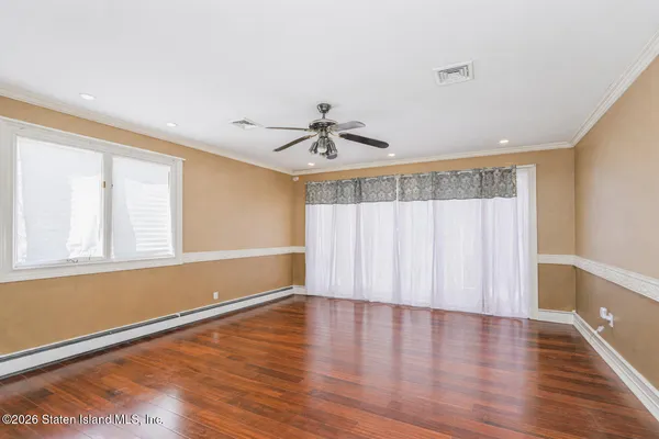 a view of an entryway with wooden floor