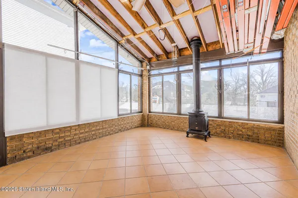 a view of an empty room and fire place