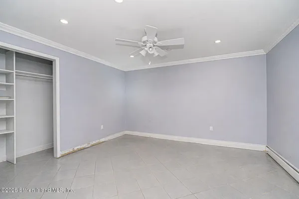 a kitchen with granite countertop wooden cabinets stainless steel appliances and a window