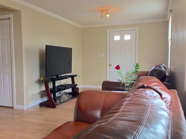 46 Oak Neck Road Hyannis, MA 02601 - Photo 3 of 21 a bedroom with furniture and a flat screen tv