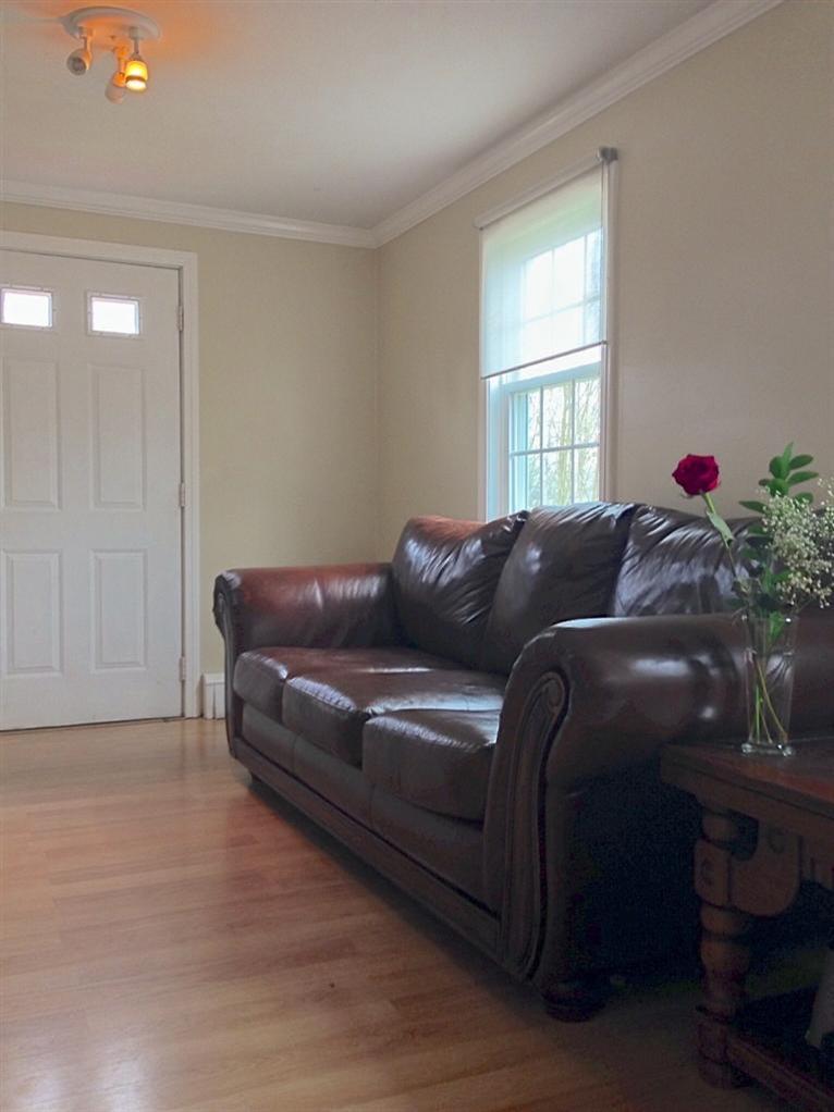 46 Oak Neck Road Hyannis, MA 02601 - Photo 8 of 21 a living room with a couch and a window