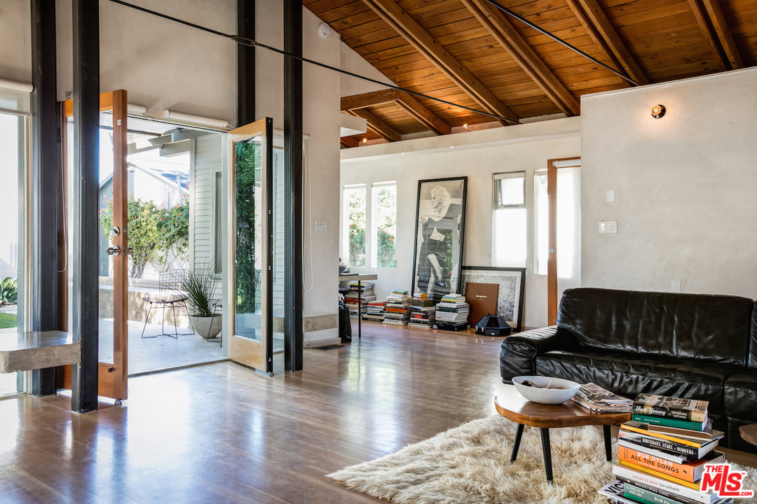 650 Sunset Avenue Venice, CA 90291 - Photo 4 of 20 a building outdoor space with patio furniture and wooden floor